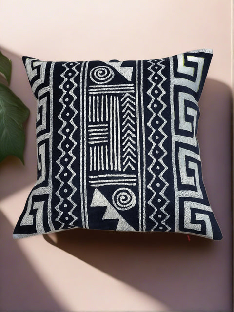 Navy boho design throw pillow. Handmade and hand-painted. Crafted from sustainable materials and ethically sourced from Zimbabwe. Add a touch of comfort and style to your home while supporting fair trade practices.
